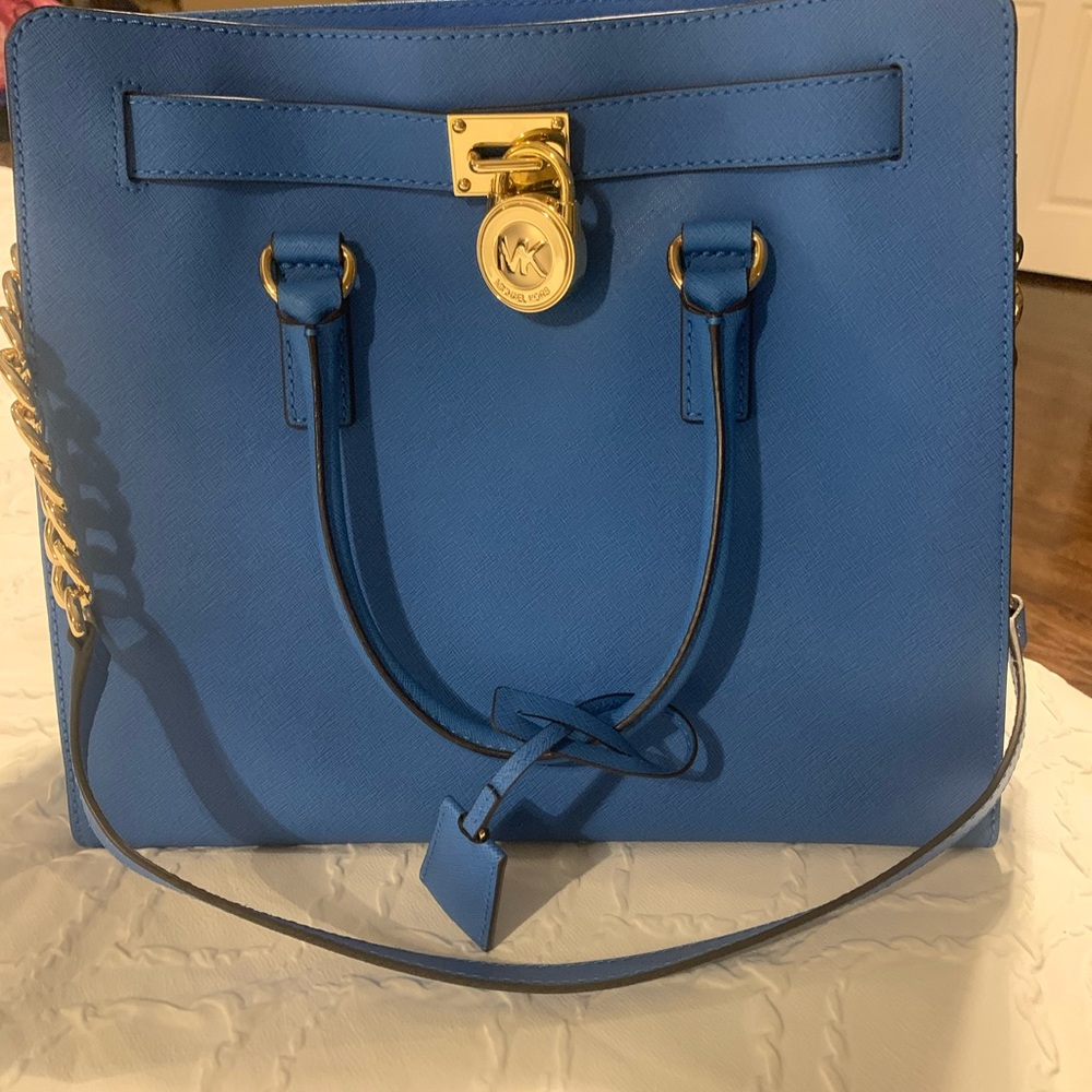 Beautiful large MK tote with handles. New without tags. No scuffs no marks
